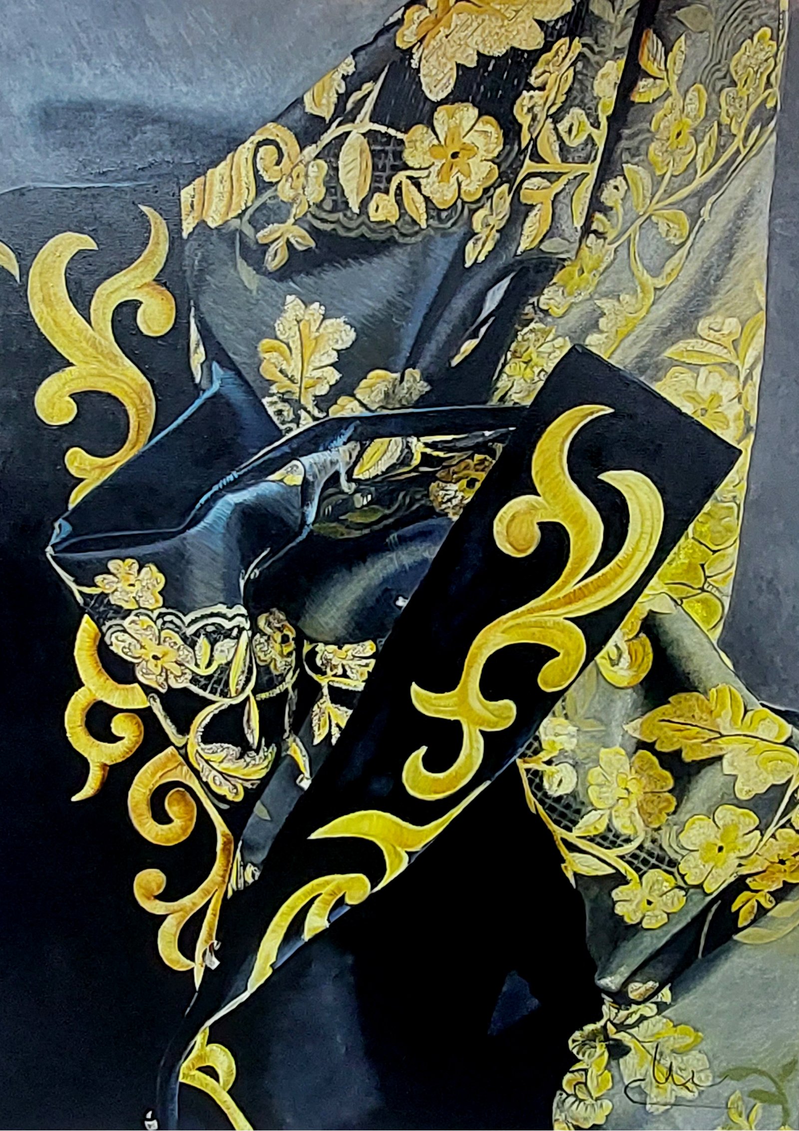 Óleo en negro y dorado que amplía el bordado damasquinado de un traje.